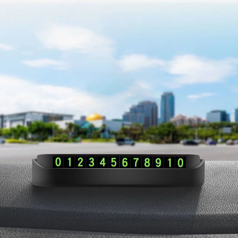 Portable concealed temporary parking sign with luminous phone number plate