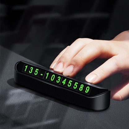 Portable concealed temporary parking sign with luminous phone number plate